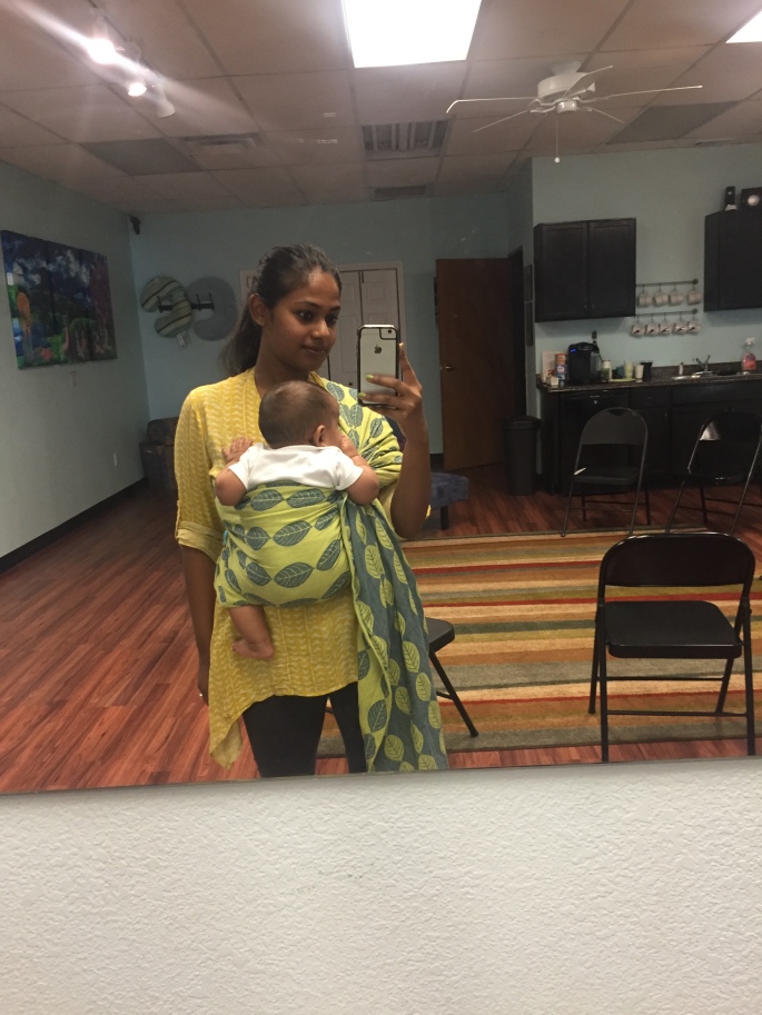 Mother wearing baby in Soul Ring sling